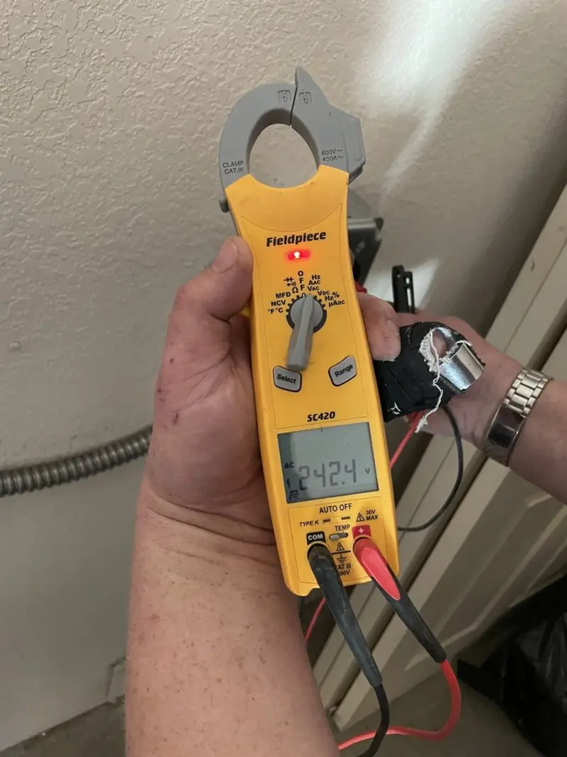 Voltage testing with clamp meter during Outlet Installation in Epping